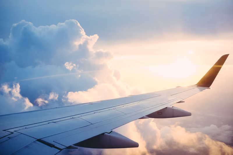 Plane wing above the clouds